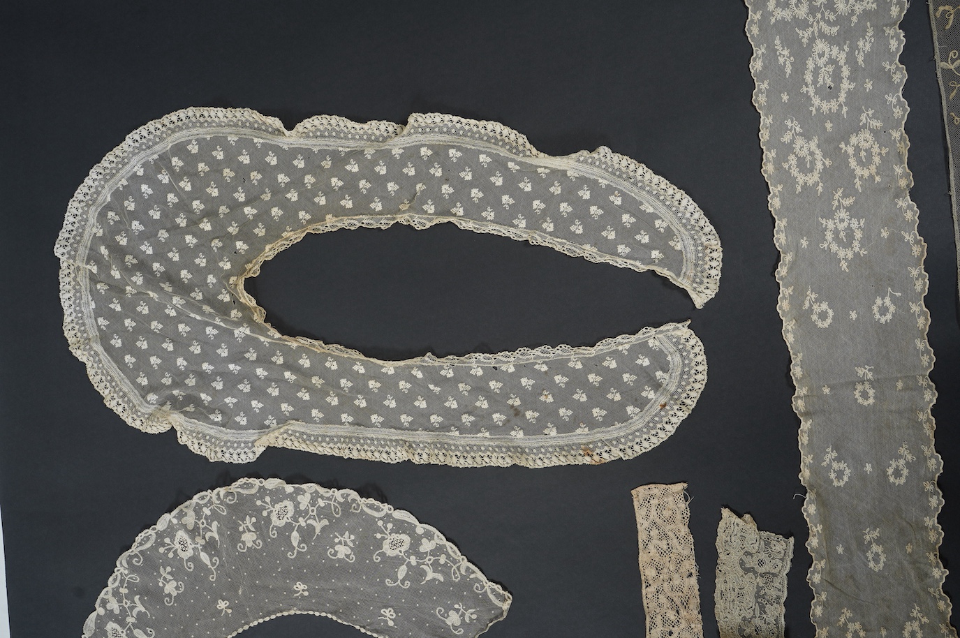 An early 19th bobbin lace length and a Brussels needle lace length, a Brussels bobbin lace wedding hankie and Brussels collar and length of trimming, a needle run collar and similar stole. (7). Brussels bobbin trim 250cm